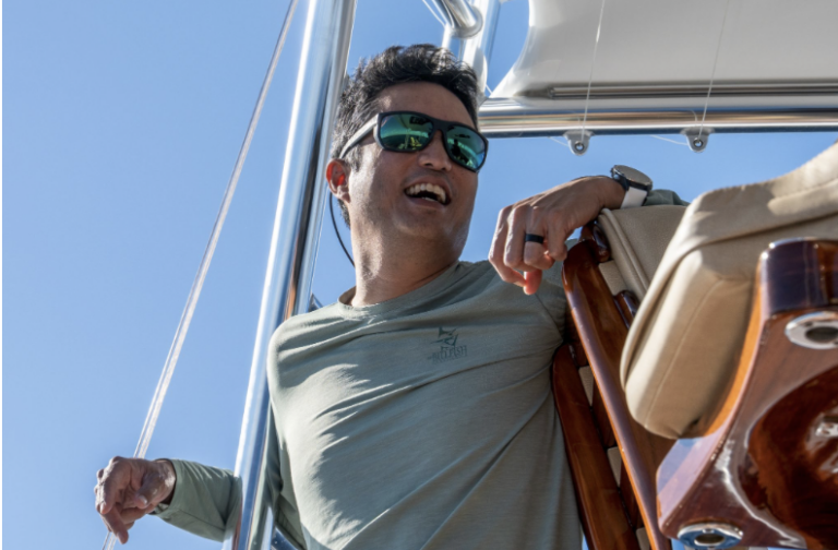Peter Chaibongsai wearing sunglasses aboard a boat